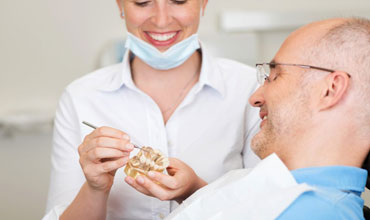 Dentist explaining to patient